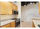 Bright kitchen area featuring stainless steel appliances and white countertops at 32 Peachtree Nw St # 1303, Atlanta, GA 30303