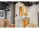 Kitchen featuring stainless steel appliances, light wood cabinetry, and hardwood floors at 32 Peachtree Nw St # 1303, Atlanta, GA 30303