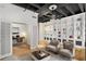 Bright living room showcasing built-in shelving, hardwood floors, and modern furnishings at 32 Peachtree Nw St # 1303, Atlanta, GA 30303