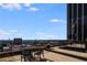 Enjoy city views from this rooftop patio, complete with a table and chairs at 32 Peachtree Nw St # 1303, Atlanta, GA 30303