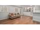 Cozy finished basement space with hardwood floors and a view to a bar and the kitchen upstairs at 3221 Goldenchain Dr, Lithonia, GA 30038