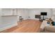Finished basement with a brick fireplace, light gray walls and hardwood floors at 3221 Goldenchain Dr, Lithonia, GA 30038