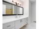 Bright bathroom featuring a marble countertop, updated fixtures, and tiled floors at 3221 Goldenchain Dr, Lithonia, GA 30038