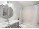 Bathroom with an updated vanity and a shower/tub combo at 3221 Goldenchain Dr, Lithonia, GA 30038