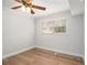 Bedroom with hardwood floors, a ceiling fan, and a window at 3221 Goldenchain Dr, Lithonia, GA 30038