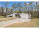 Front exterior showcasing the home's facade, driveway, and attached garage at 3221 Goldenchain Dr, Lithonia, GA 30038