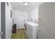 Laundry room equipped with washer, dryer, and ample storage space at 3221 Goldenchain Dr, Lithonia, GA 30038