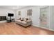Living room with a fireplace, hardwood floors and lots of natural light at 3221 Goldenchain Dr, Lithonia, GA 30038