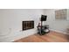Living room with a painted brick fireplace and hardwood floors at 3221 Goldenchain Dr, Lithonia, GA 30038