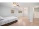 Spacious main bedroom with two windows and a doorway to the staircase at 3221 Goldenchain Dr, Lithonia, GA 30038