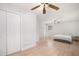 Spacious main bedroom with hardwood floors and a ceiling fan at 3221 Goldenchain Dr, Lithonia, GA 30038