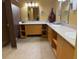 Well-lit bathroom with multiple sinks, ample counter space, storage cabinets and mirror at 400 17Th Nw St # 2031, Atlanta, GA 30363