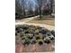A landscaped community area featuring a flower bed and seating at 400 17Th Nw St # 2031, Atlanta, GA 30363