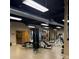Gym interior with high ceilings, ductwork, weights and multiple exercise machines at 400 17Th Nw St # 2031, Atlanta, GA 30363