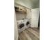 A well-organized laundry room with modern washer and dryer units, maximizing space and efficiency at 400 17Th Nw St # 2031, Atlanta, GA 30363