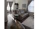 Cozy living room featuring a comfortable leather sofa and a view into the dining area at 400 17Th Nw St # 2031, Atlanta, GA 30363