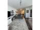 Open-concept living room featuring stylish decor, hardwood floors, and seamless integration with the modern kitchen at 400 17Th Nw St # 2031, Atlanta, GA 30363