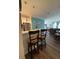 Open-concept living space with bar seating, modern kitchen, dining area, and comfortable lounge area at 400 17Th Nw St # 2031, Atlanta, GA 30363