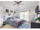 Cozy bedroom boasts natural light, decorative touches, and a comfortable queen bed at 4514 Heathrow Nw Ct, Kennesaw, GA 30152