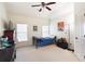 Bright, cozy bedroom featuring a large window and neutral color palette at 4514 Heathrow Nw Ct, Kennesaw, GA 30152