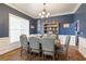 Formal dining room with elegant wainscoting, a chandelier, and a spacious layout for entertaining at 4514 Heathrow Nw Ct, Kennesaw, GA 30152