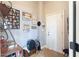 Organized entryway with a white door, storage trunk, and decorative wall art, enhancing the home's appeal at 4514 Heathrow Nw Ct, Kennesaw, GA 30152