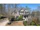 Beautiful two-story brick home with symmetrical design, front porch, and well-manicured landscaping at 4514 Heathrow Nw Ct, Kennesaw, GA 30152
