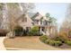 Charming two-story brick home with covered front porch, shutters, and lush lawn at 4514 Heathrow Nw Ct, Kennesaw, GA 30152