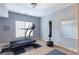 Home gym with treadmill, punching bag, and natural light at 4514 Heathrow Nw Ct, Kennesaw, GA 30152