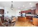 Well-lit kitchen with granite countertops, stainless steel appliances, hardwood floors, and access to a breakfast nook at 4514 Heathrow Nw Ct, Kennesaw, GA 30152