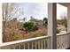 Elevated porch view showcasing the property's exterior and beautiful garden, offering a peaceful retreat at 4514 Heathrow Nw Ct, Kennesaw, GA 30152