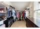 Walk-in closet with shelves, rods, and drawers provides ample storage space at 4514 Heathrow Nw Ct, Kennesaw, GA 30152