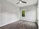 Bright bedroom featuring hardwood floors and large window, offering a comfortable and airy atmosphere at 490 Third Ave, Scottdale, GA 30079