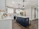 Bright kitchen featuring a central island, modern appliances and white countertops at 490 Third Ave, Scottdale, GA 30079