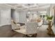 Elegant living room with a coffered ceiling, modern furniture, and access to outdoor spaces at 490 Third Ave, Scottdale, GA 30079