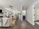 Open-concept living room featuring modern decor, hardwood floors, and a coffered ceiling at 490 Third Ave, Scottdale, GA 30079