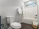 Bright bathroom with a shower and patterned tile above window that allows for lots of natural light at 490 Third Ave, Scottdale, GA 30079