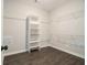 Spacious walk-in closet featuring custom shelving and ample storage space for an organized wardrobe at 490 Third Ave, Scottdale, GA 30079