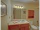 Well-lit bathroom features a large mirror and standard fixtures at 1005 Berkeley Woods Dr, Duluth, GA 30096
