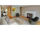 Bright living room featuring a fireplace, hardwood floors and modern furniture at 1005 Berkeley Woods Dr, Duluth, GA 30096