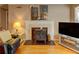 Cozy living room with fireplace and hardwood floors at 1005 Berkeley Woods Dr, Duluth, GA 30096