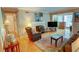 Comfortable living room featuring a fireplace and warm hardwood floors at 1005 Berkeley Woods Dr, Duluth, GA 30096