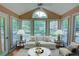 Cozy sunroom featuring lots of windows and modern furniture at 1005 Berkeley Woods Dr, Duluth, GA 30096