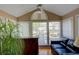 Bright sunroom with vaulted ceiling, large windows, and hardwood floors at 1005 Berkeley Woods Dr, Duluth, GA 30096