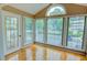 Sunroom featuring large windows and vaulted ceilings at 1005 Berkeley Woods Dr, Duluth, GA 30096