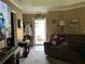 Cozy living room with comfortable seating and a bright view through the doorway, creating an inviting atmosphere at 1109 Granite Ln, Loganville, GA 30052