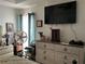 Comfortable primary bedroom featuring a large television and well-organized storage for a relaxing and functional space at 1109 Granite Ln, Loganville, GA 30052