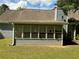 Charming sunroom featuring multiple windows and views of the lush backyard at 1109 Granite Ln, Loganville, GA 30052