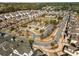 Community aerial view showcases a clubhouse, pool, and other amenities at 1157 Hannaford Ln, Johns Creek, GA 30097