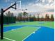Well-maintained community basketball court with modern hoops and green and blue painted surface at 1157 Hannaford Ln, Johns Creek, GA 30097